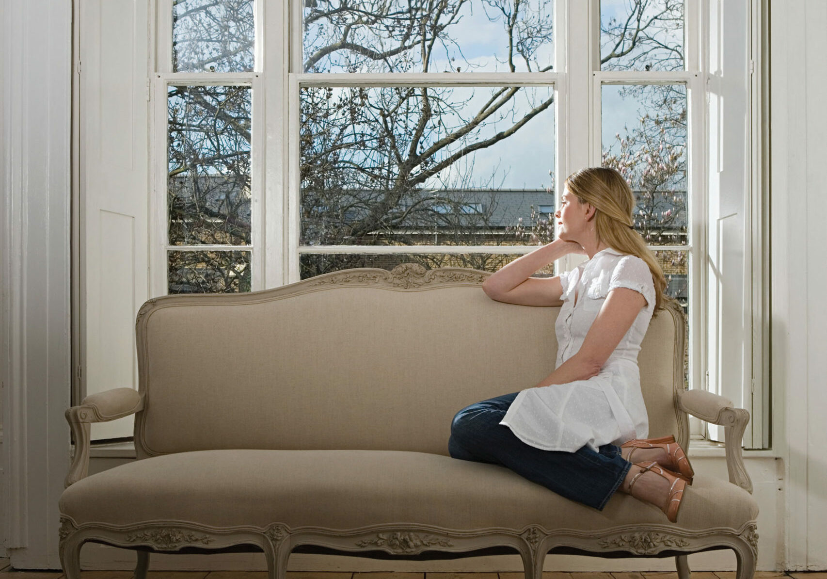 Woman looking out of a window